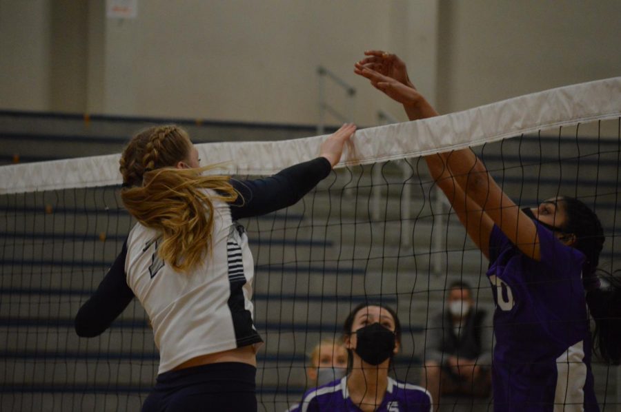 McKenna Wiepert tips the ball over the net and gains the point. The Wildcats win their final game of the season, winning 3 of the 4 sets.