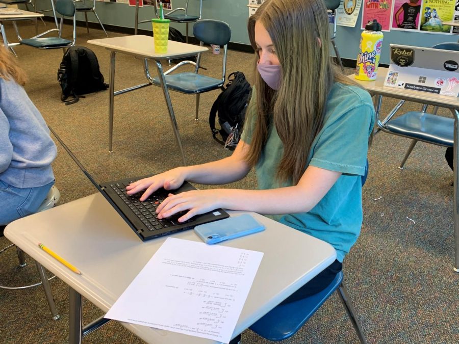 Senior Kate Jeffries studying for her upcoming exams. This year, students have had to adjust their study habits because of the extended timeline of AP tests.