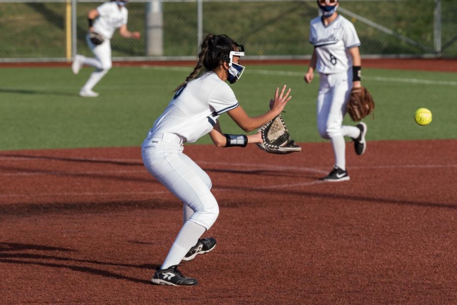 Senior Kylie Hadden fielding a ball during their game against Rex Putnam. The Wildcats finish undefeated in home games and look to play two more games this season.