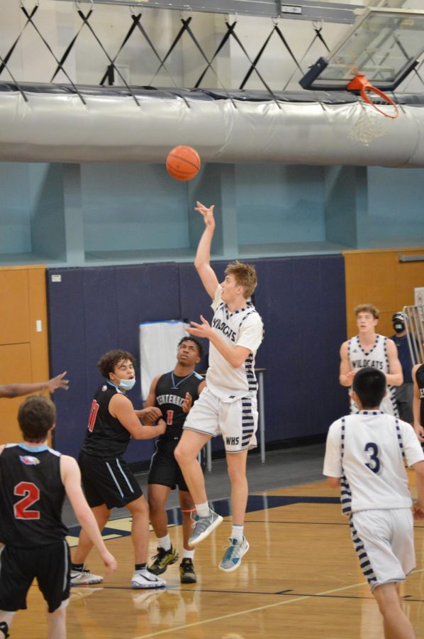 Senior Cason Dougal makes a two. The boys baskeetball team came up with a big win against Centennial.