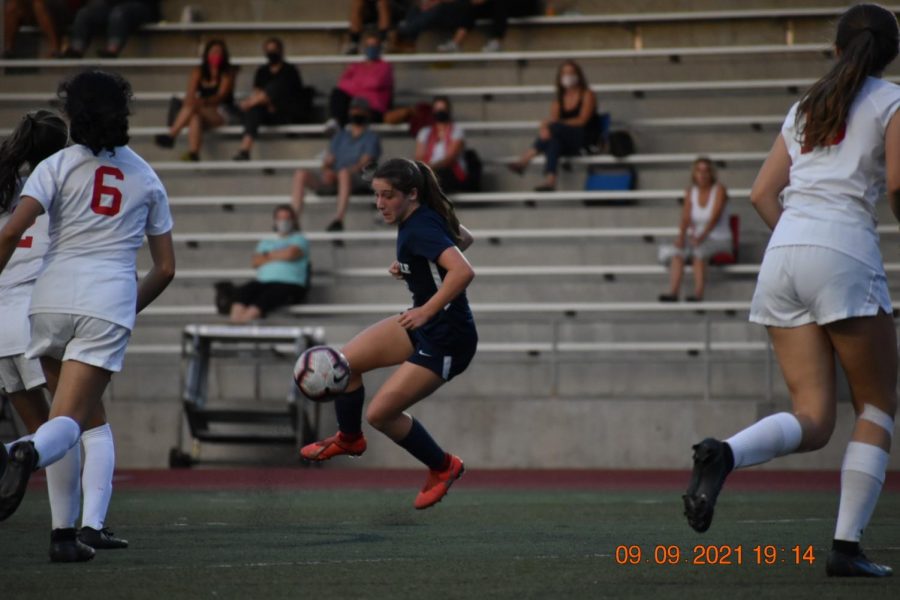 Freshman Kenley Whittaker skillfully juggles the ball as the Cats attempted to extend their lead in the first half.