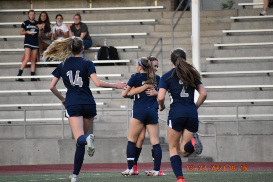 Lindsey Antonson and Karina Borgen embrace after Antonson scored the first goal during their match against Westview.