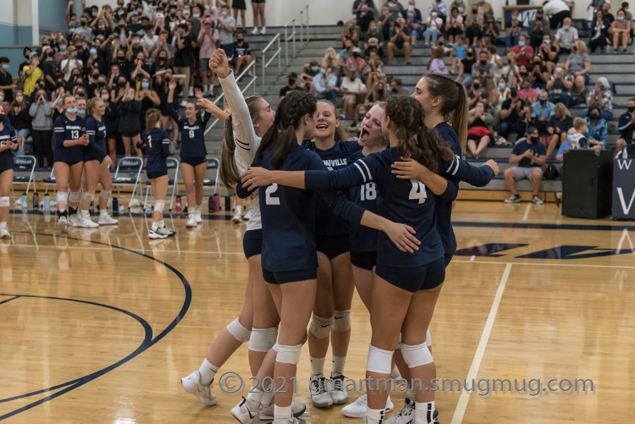 Wilsonville celebrates after taking a second set.