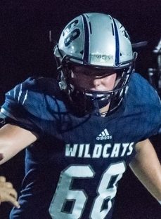 Mason Seal blocking a Lebanon defensive end in a 35 to 19 wildcat victory.