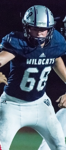 Mason Seal blocking a Lebanon defensive end in a 35 to 19 wildcat victory.