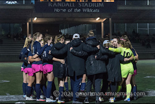 Girls Soccer Huddling Before their Game