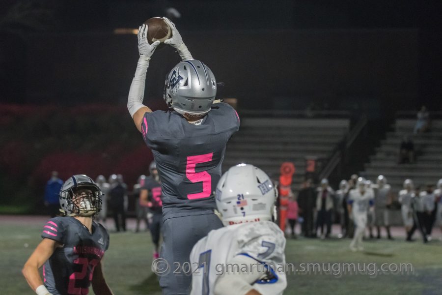 Connor Green makes a leaping interception to help seal a Wildcat victory.