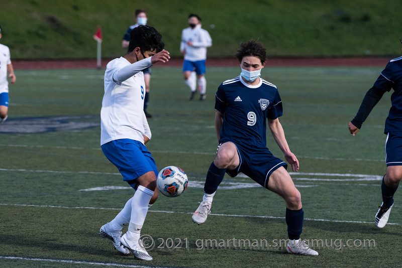 Toshi Kondo playing defense. Kondo was able to steal the ball from his opponent. 