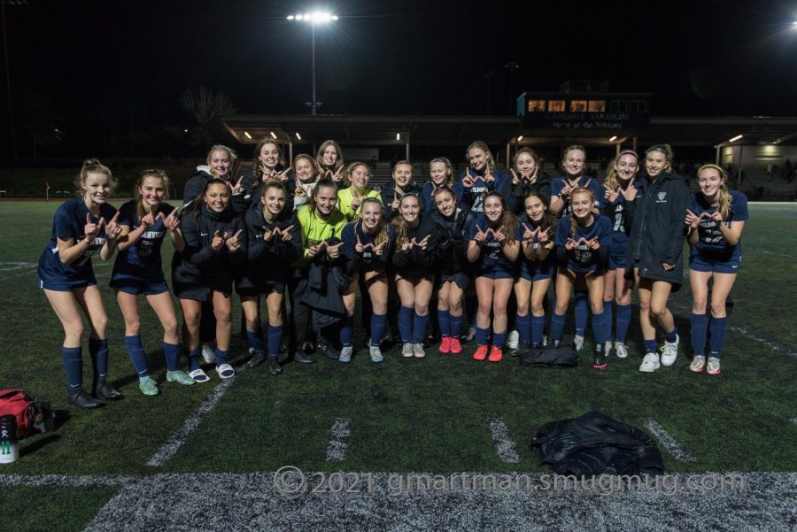 Girls soccer posing for a picture after a win.   The team's amazing season culminated in winning the State Championship.