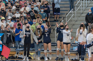 Volleyball Team and Student Section After Scoring a Point