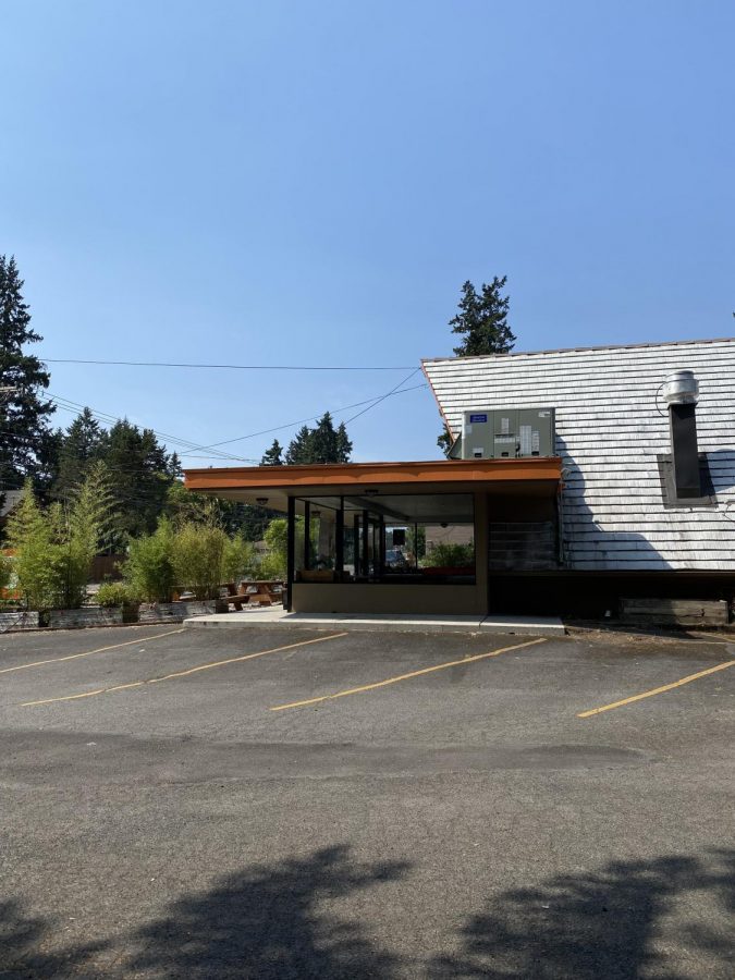 A view of the cafe from the parking lot over the summer. Not a person is in sight.