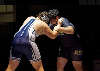 Wilsonville Wrestling vs St Helens. The Cats dropped this duel. 