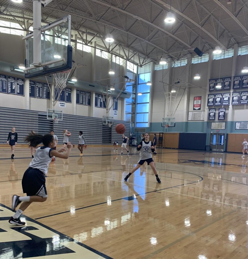 Kylie Fox catches an inbound pass from Kiera Easterly during Fox's very first practice back. Fox started out the year on JV, but early in the season (before her kidney surgery) Fox was asked to swing for the Varsity team.