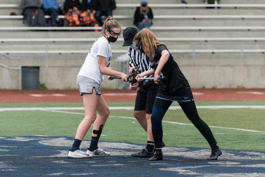 Maura Schramm, Class of 2021 alumni, takes the draw in the Cats' final game agaisnt Mountainside. Schramm is now playing for Gerogia Tech's club womens lacrosse team!