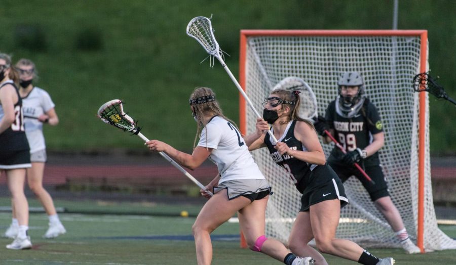 Tatum Hagen looks to score in the Cat's 2021 league game agaisnt the Oregon City/Clackamas mixed team. Hagen was one of the Cats' leading scorers. In the picture, you can identify the lack of help-side defense (like there would be in a basketball game) due to the shooting space rule.