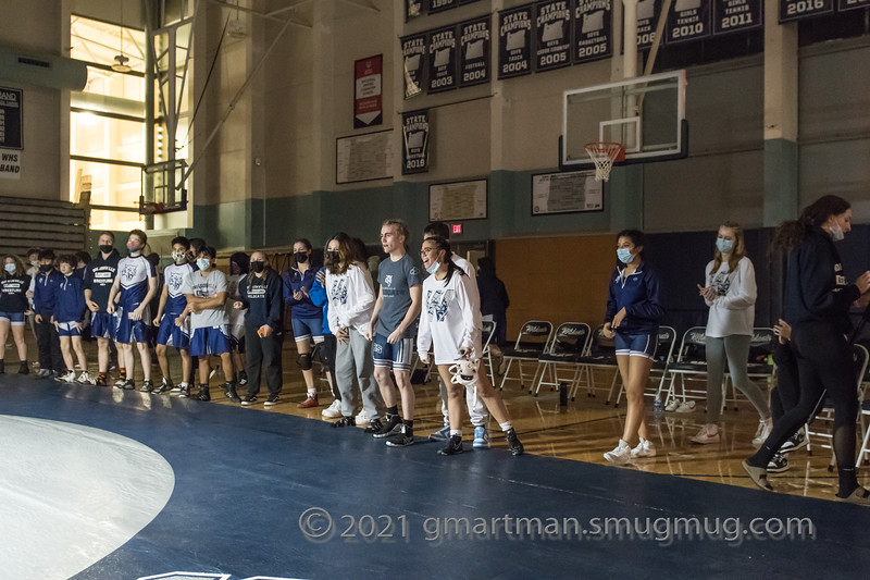 The Wilsonville Wrestling team cheers on their teammate as the match intensifies.