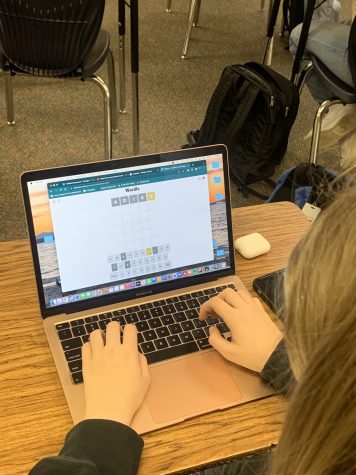 Alina Jakobson playing her daily Wordle. Her favorite word to start with is adieu.