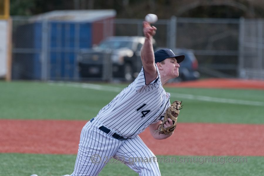 Keenan Sanford deals in a 12-2 victory over Grants Pass.