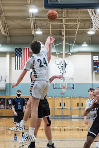 Kyle Counts blocks opponents shot. Like Counts, many athletes have mixed feelings on the shot clock as it's good for defense but could be hard for offense.