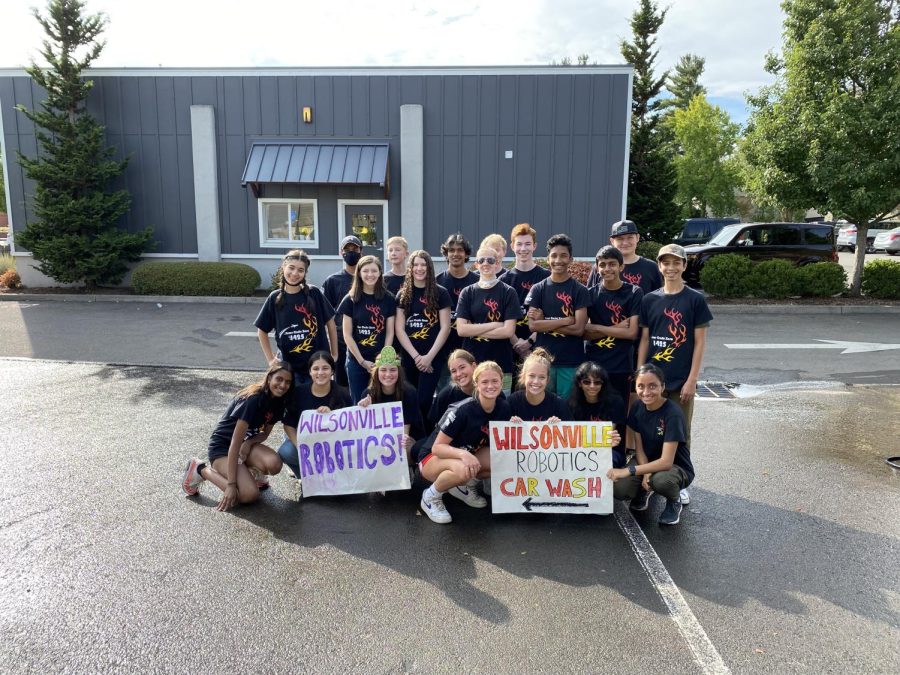 Team 1425 posing for a photo after their car wash. Go support them at their upcoming fundraising events!