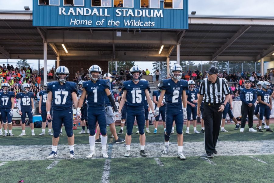 Wilsonville football stands with the cheering crowd. An exciting day for Wilsonville students.