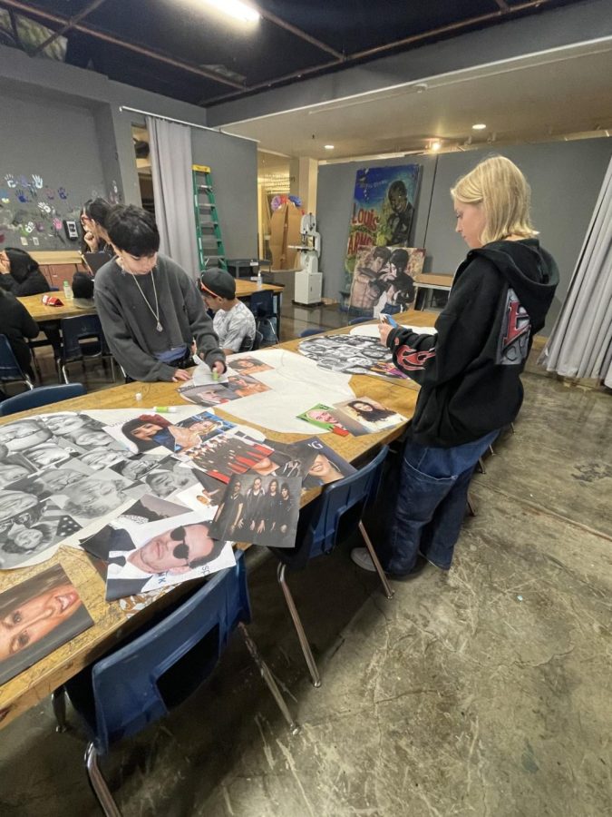 Mia Murray and Brandon Dorantes working on the mural