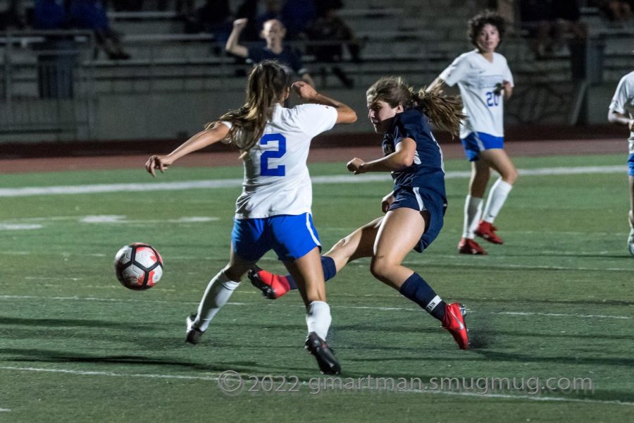 Kenley Whittaker takes a shot on goal against Woodburn. This was one of her two goals.