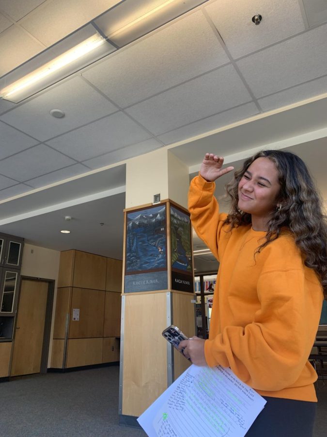 Freshman Milan Delacruz winces at the lighting. She is struggling to find a place to do her work where she won't get a headache.