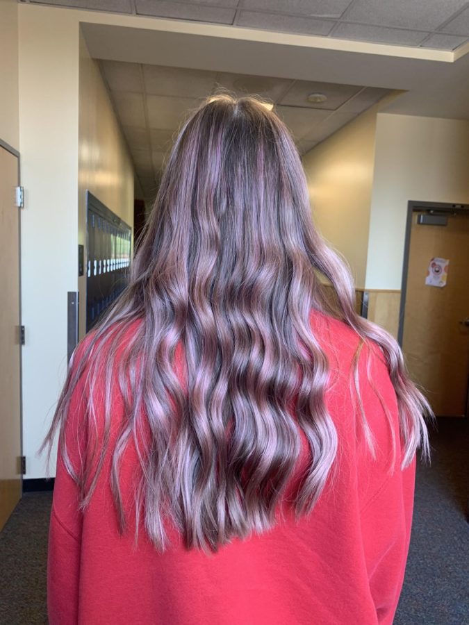 Senior Natalie Kendig shows off her pink hair. She is excited to go all out for pink out. 