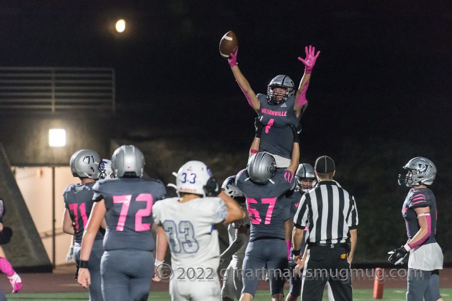 Brennan Martin hoists fellow senior Cooper Hiday overhead celebrating a TD on senior night. Martin and Hiday are both critical players on this team, leading the Wildcats on and off the field.