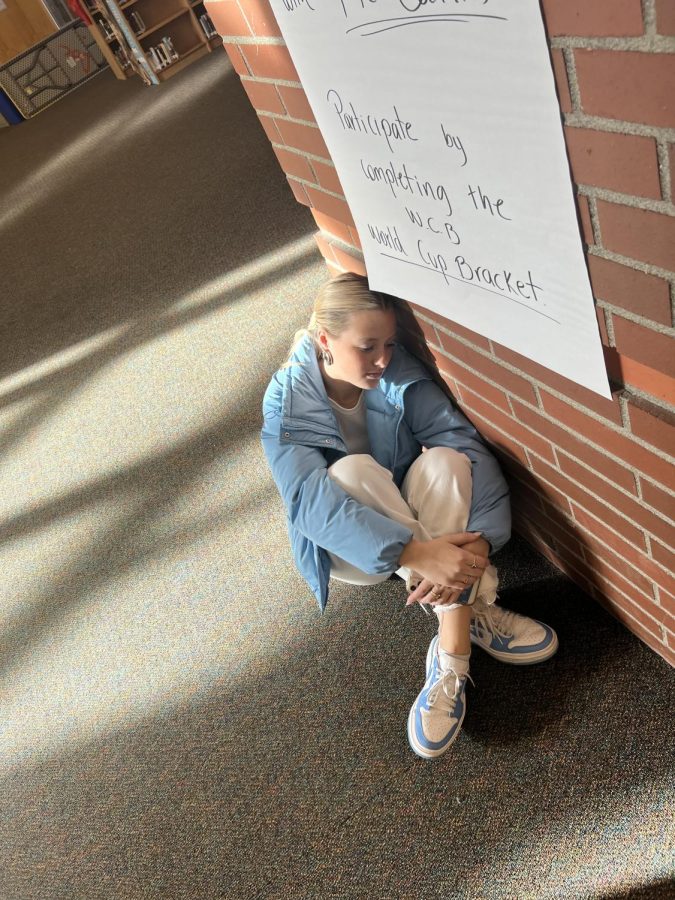 Faith Nashif (senior) spending some alone time while pondering heavily with her head against the wall. What is she thinking about?