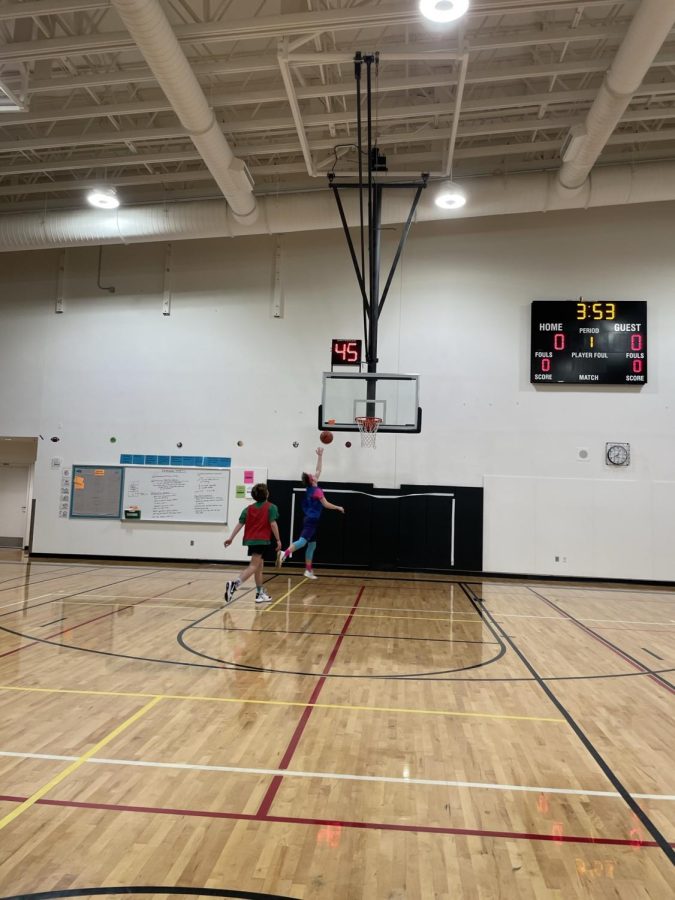 Luke Larson takes the ball to the rack for a lefty layup from a right hander. He definitely has translated his basketball skills from his time playing freshmen basketball and select teams in middle school. 