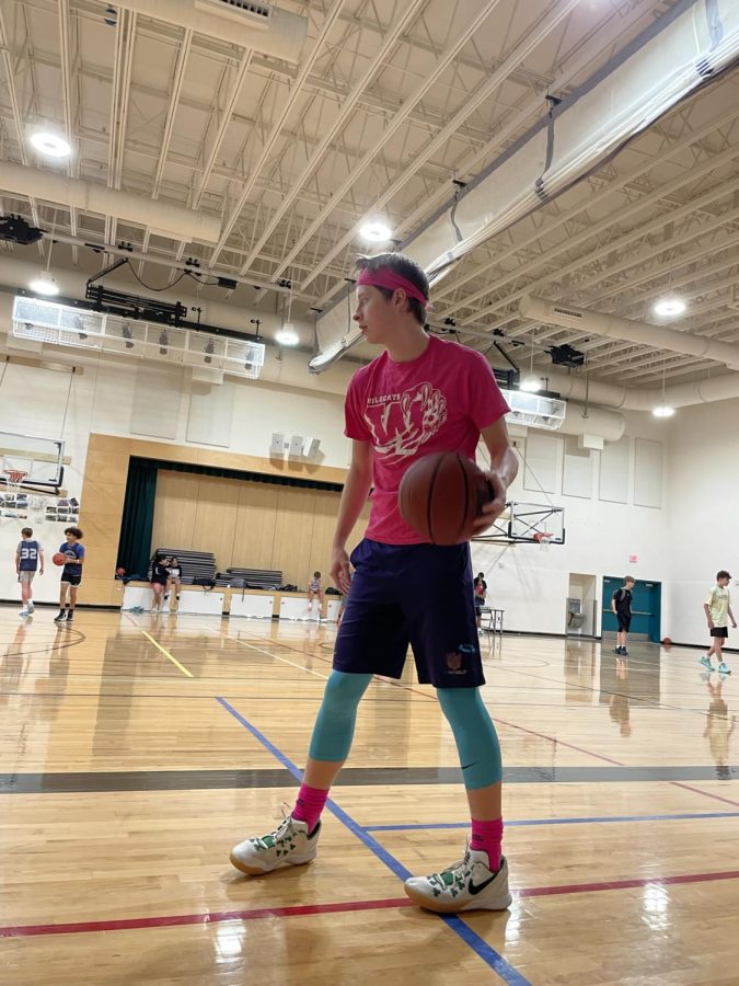 Luke shows off the Kyrie 3 St Patricks Day edition shoes. It has good traction on the gym floor and a cushioned insole to protect his ankle after jumping from shooting many threes.  