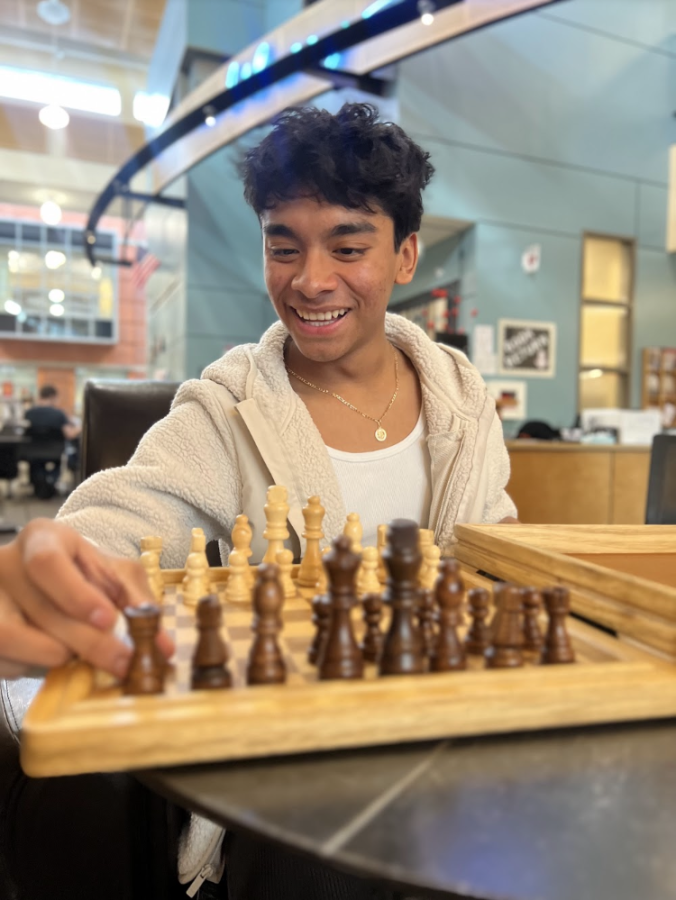  Anthony Herrera takes a break from class to play a quick game of chess. Students often find peace during their hectic day in the school's library.