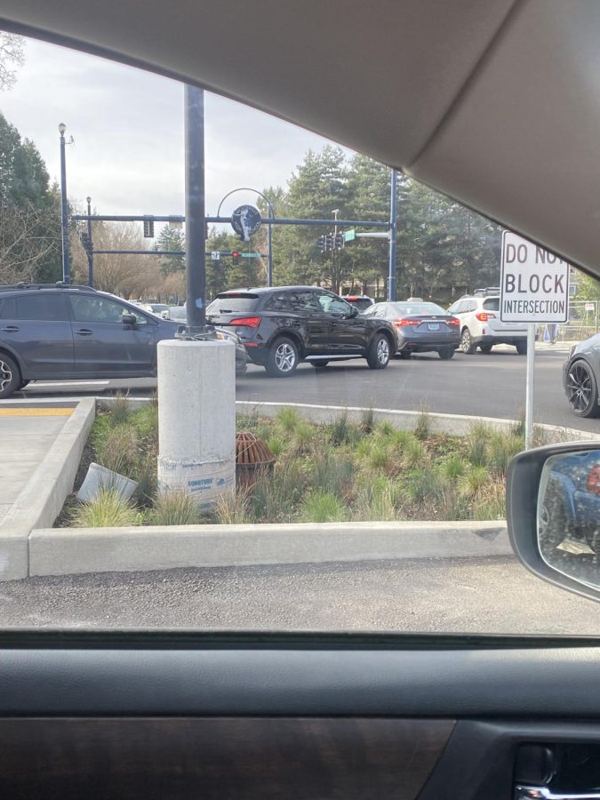The above image shows the chaos that ensues in the single intersection in which cars and buses can enter and exit the parking lot. 