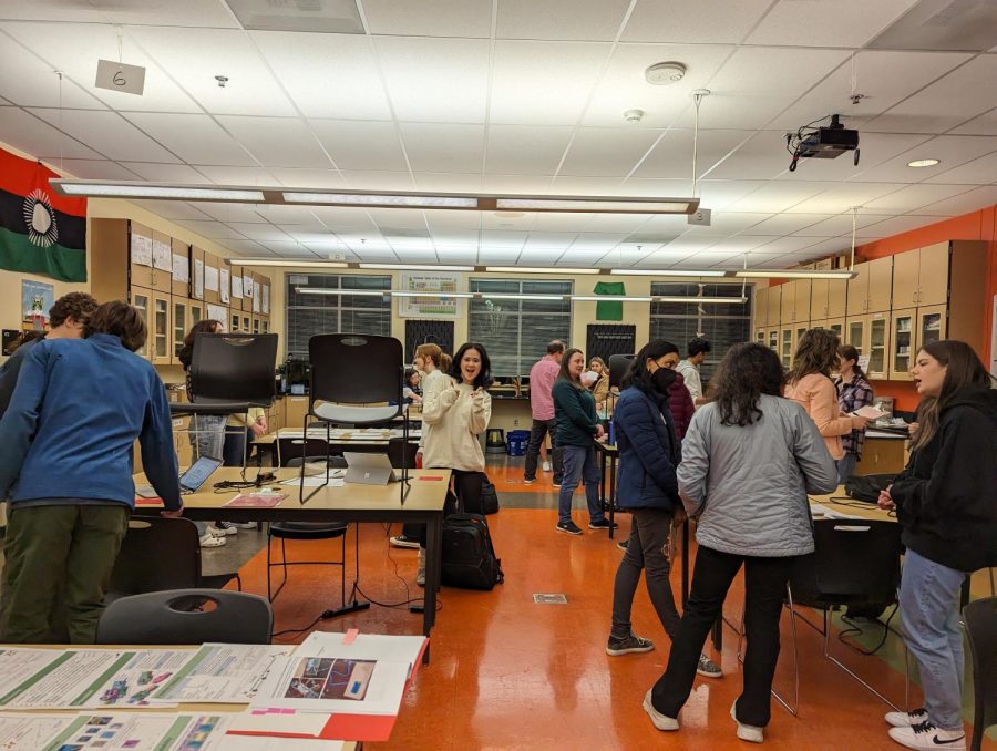 Junior Kate Kurata stands amidst one of many rooms at the mock fair. Students practice judging sessions with practice boards at this event.