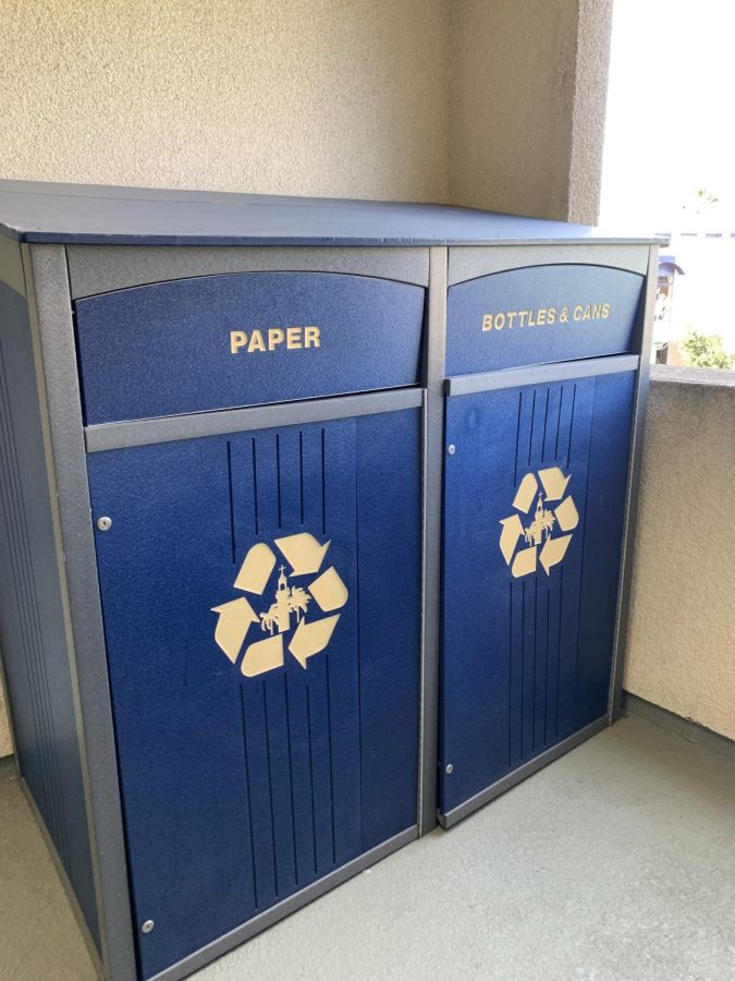 Large recycling bins at a university that claims to be a "green campus." Recycling bins like these make it easier for lazy students to make the right decision.  