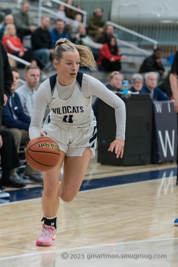 Faith Nashif drives to the basket in a 39-64 defeat against La Salle. Nashif finished the game with 5 points.