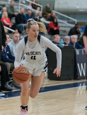 Faith Nashif drives to the basket in a 39-64 defeat against La Salle. Nashif finished the game with 5 points.