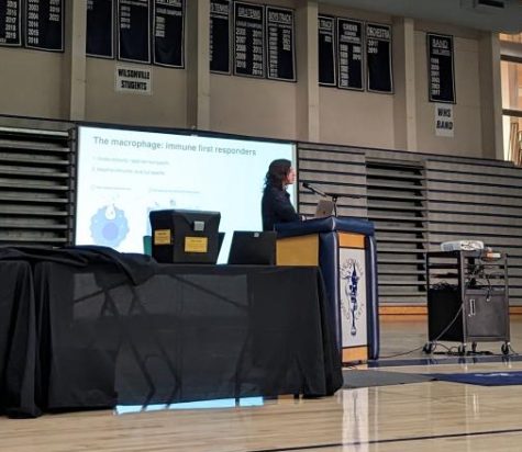 Mrs. Nicole Day gives a speech on her pHd work on macrophages. She was part of the Wilsonville HS class of 2015.