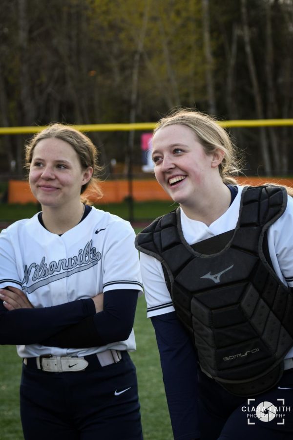 Marry Mathews and Maddie Holly giggling at Coach Harms' dad jokes. These two have been starting together since freshman year and have been vital to the Wildcats. 