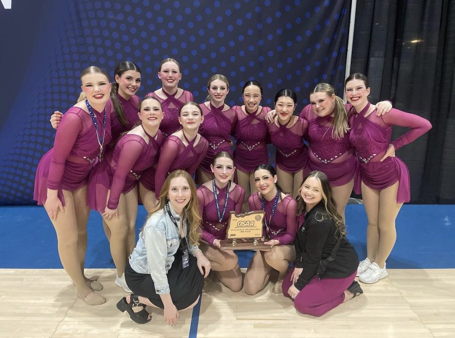 The Wilsonville dance team posing with their trophy. The girls placed in third for their Pom routine.