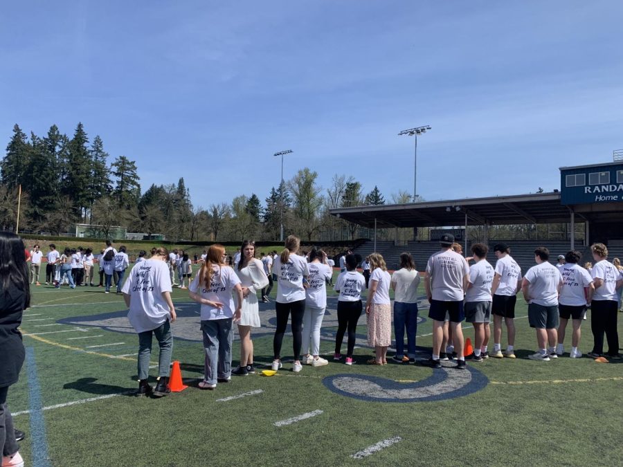 Seniors line up on the football field in preparation to take their senior photo. That photo will be used in the school yearbook. 