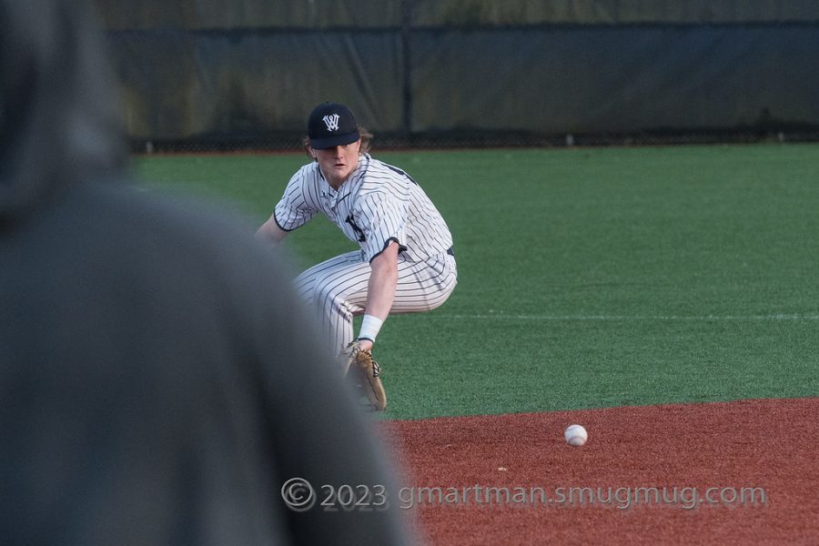 Player Mark Weipert tries to catch a loose ball.