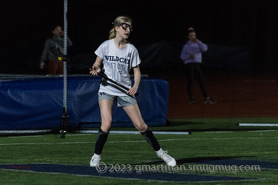 Wilsonville Girls lacrosse player carrying the ball to victory. Photo credit Greg Artman.