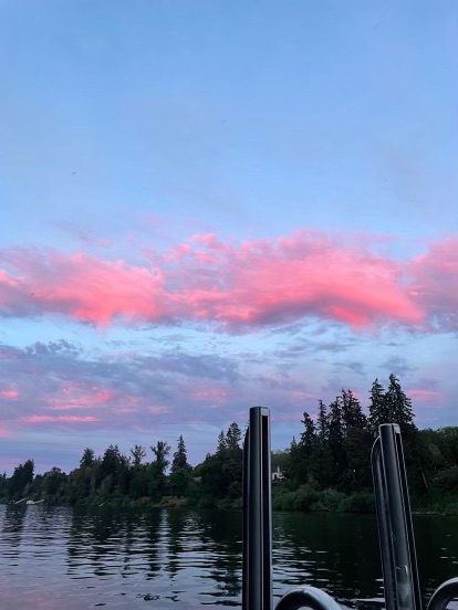 Junior Aida Simonton watches the sunset from the dock over the Willamette River. She is one of many students at Wilsonville High School who enjoy sunset views. 