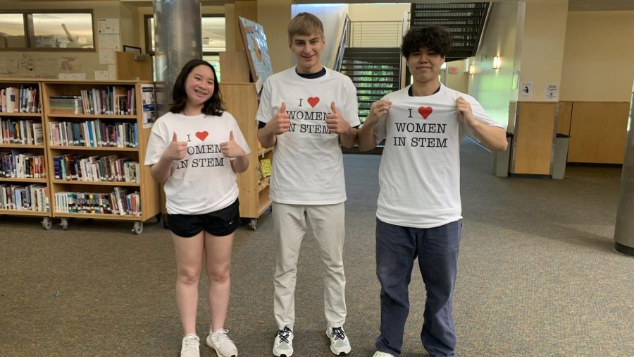 Anthea Goh is pictured with senior George Peykanu, center, and junior Paul Liu wearing her class t-shirts. While Peykanu and Liu are AP physics students (E&amp;M and C, respectively), many other students have purchased these shirts. 