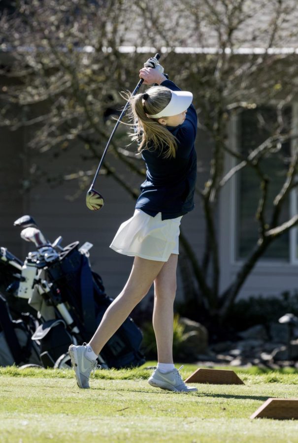 Senior captain Mia Combs taking a swing. Girls golf remains undefeated in league tournaments. 