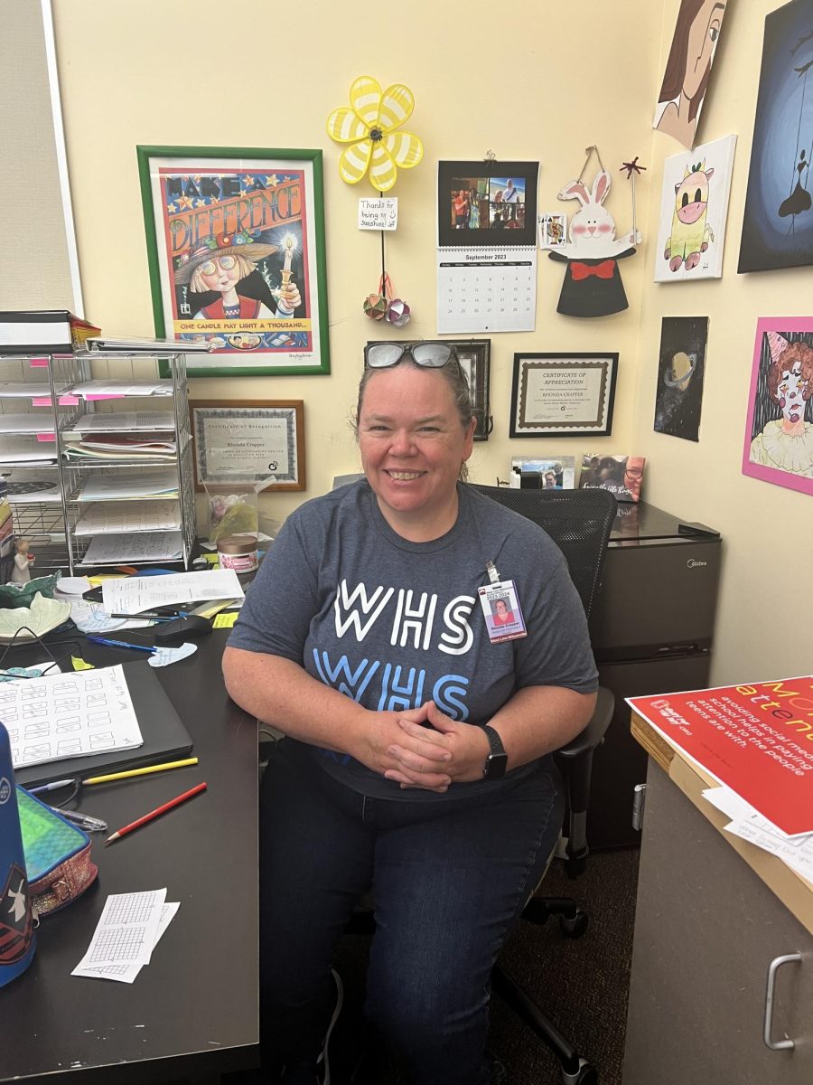 Mrs Crapper sits happily in her teaching nook, where were classroom is. She is excited for the upcoming days she can teach.