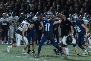 Kallen Gutridge throws a pass in last years 7-44 loss to Tualatin. Wilsonville looks to get their revenge on Friday.